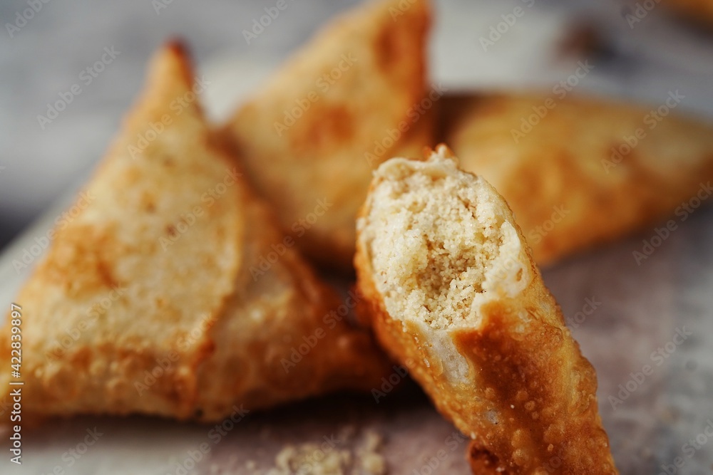 Malabar Thari Manda -Kerala deep fried snack with semlina filling, selective focus