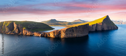 Aerial view from drone of Sorvagsvatn lake on cliffs of Vagar island in sunset time, Faroe Islands, Denmark. Landscape photography panorama photo