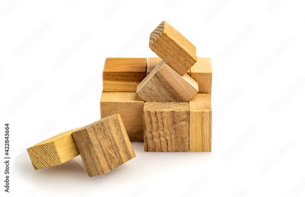 Puzzle cubes of wooden blocks isolated on white background. defocused close-up. Business success concept. Layout for presentation. Puzzle cubes of wooden blocks isolated on white background. defocused close-up. Business success concept. Layout for presentation.