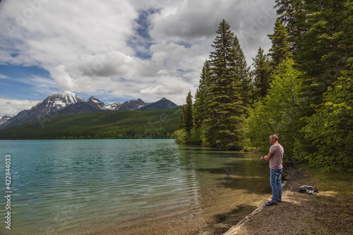 Man fishing at Bowman Lake, Montana 