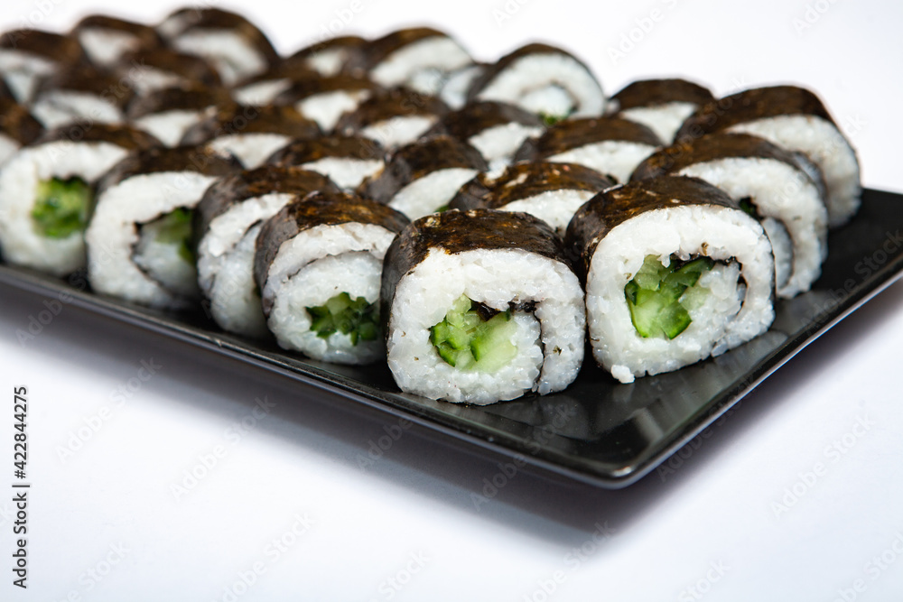 Fresh delicious japanese sushi with avocado on white background. Fresh delicious japanese sushi with avocado on white background.