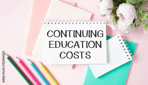 Continuing Education Costs text write on a book isolated wooden table.