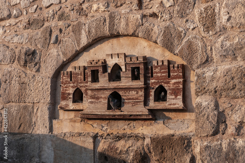 Ancient Turkish beautiful wooden dovecote. Home for pigeons in Bodrum Castle, Bodrum, Turkey.