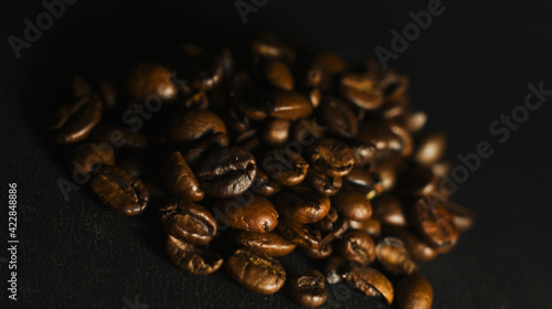 Brown Roasted Coffee Beans Closeup On Dark Background