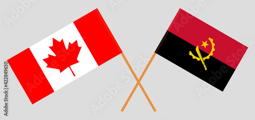 Crossed flags of Canada and Angola. Official colors. Correct proportion