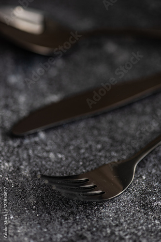 Cutlery on stone background