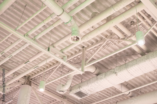 Air duct, wiring and plumbing in the mall. Air conditioner pipe, wiring pipe, and plumbing pipe system.
