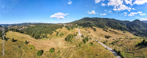 Aerial panorama of Rhodope Mountains and village of Stoykite, Bulgaria photo