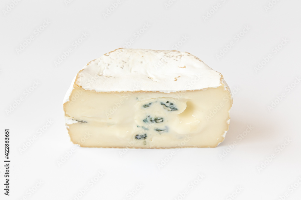 Camembert or brie cheese isolated on white background. Soft cheese covered with edible white mold view from above. Gourmet blue cheese.