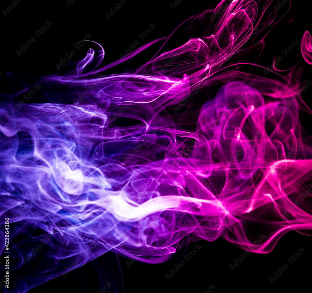 Fototapeta premium Colored smoke on black background