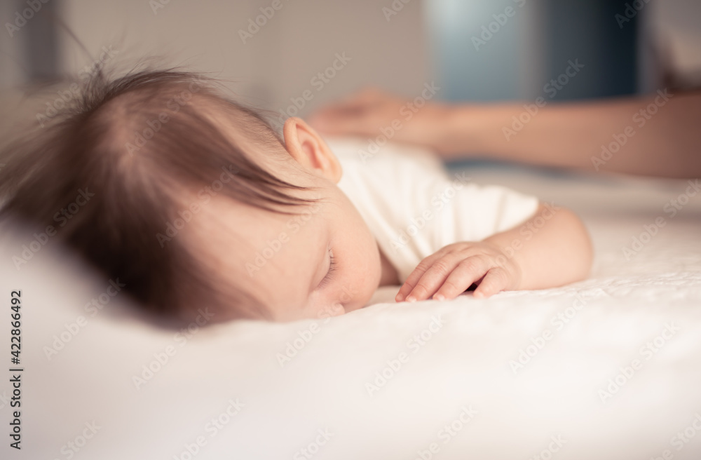 Mother putting her baby to sleep Mother putting her baby to sleep