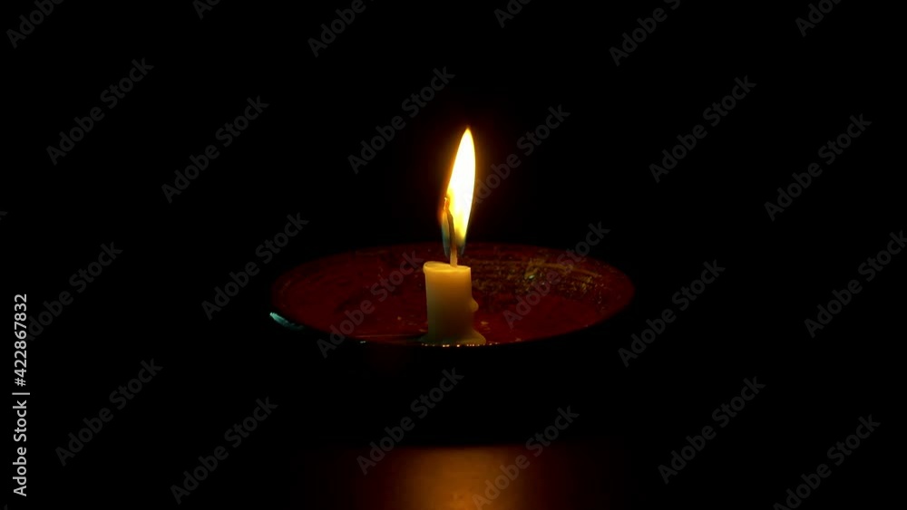 Close up candle flame Isolated on dark Background. Close up candle flame Isolated on dark Background.