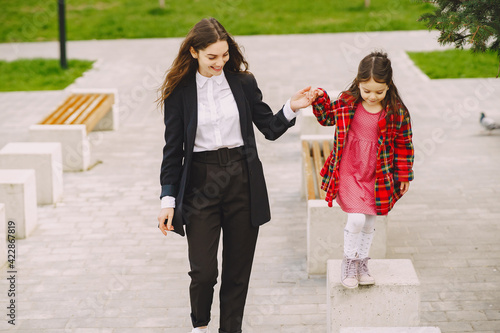 Mother and daughter in a sprong city photo