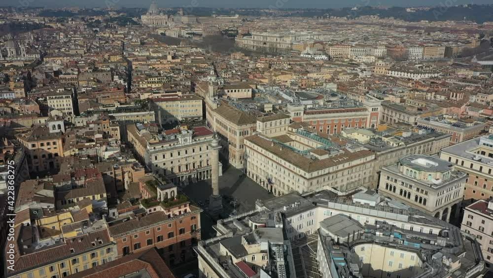 Aerial view of downtown Rome, Italy. City center with Italian government buildings in Piazza Colonna seen from drone flying in sky and Saint Peter's Basilica in Vatican City in background Aerial view of downtown Rome, Italy. City center with Italian government buildings in Piazza Colonna seen from drone flying in sky and Saint Peter's Basilica in Vatican City in background