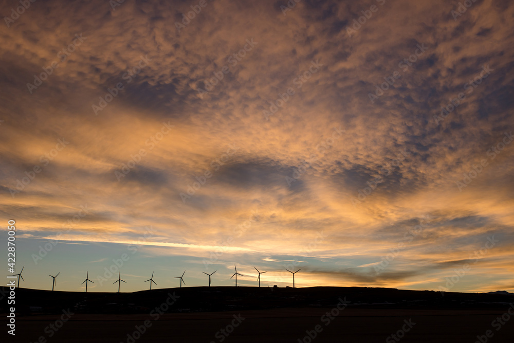 Sunset on the prairies with windmills