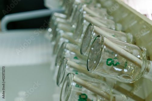 Beakers dry on a hanger. Medical or chemical laboratory concept.