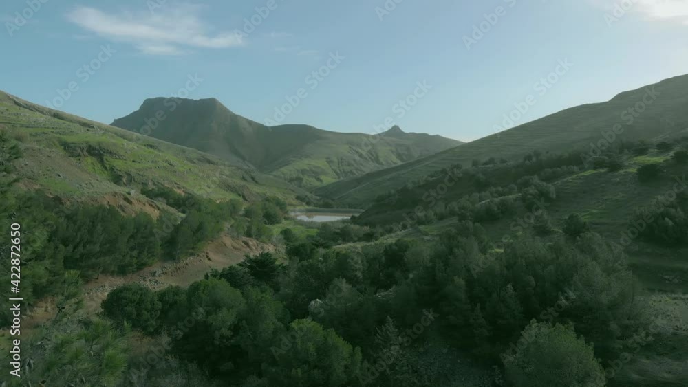 Drone taking off from top hill at Serra de Dentro on Porto Santo island, Portugal. Aerial forward