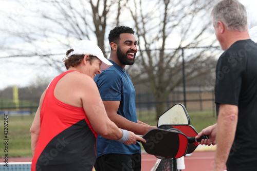 Canvas Print pickleball paddles are bumped at the conclusion of a game.