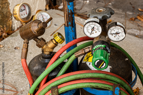Welding torch tanks with hoses and gauges