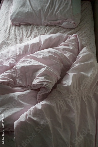 Girls Twin Sized Bed with Pink Blanket and Sheets 