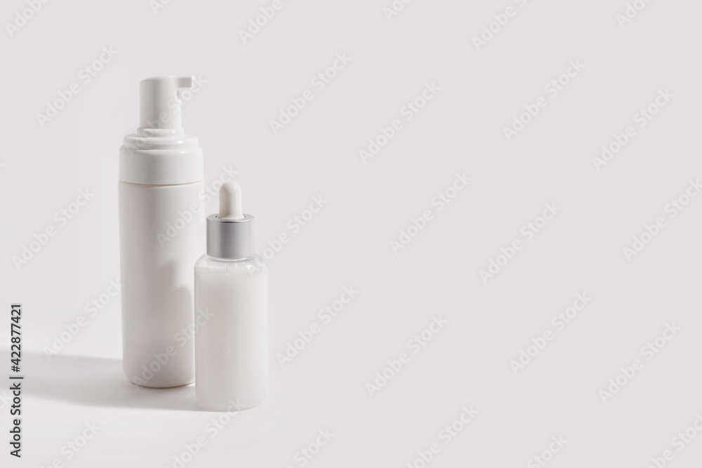 Foam container and bottle with serum on light background Foam container and bottle with serum on light background