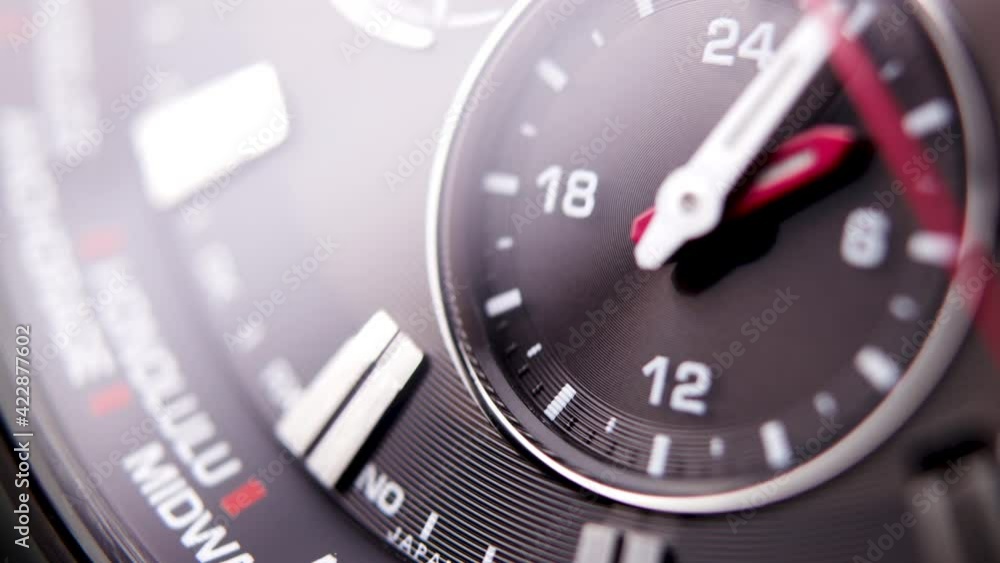 black, modern, chronograph wristwatch close-up