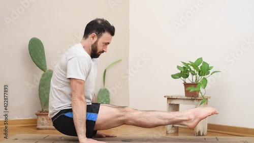 fitness and yoga indoors rising in suspension 