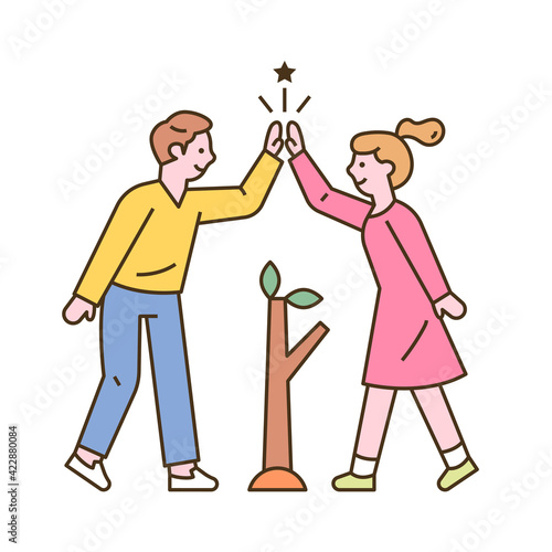 A man and a woman are planting seedlings and high five. flat design style minimal vector illustration.