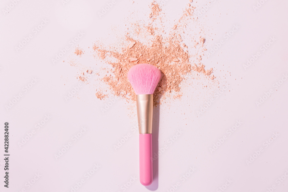 Make up brushes with powder on white background Make up brushes with powder on white background