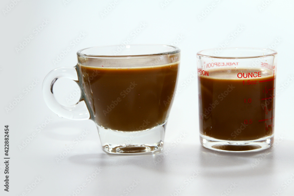 Milk coffee in transparent glass Milk coffee in transparent glass