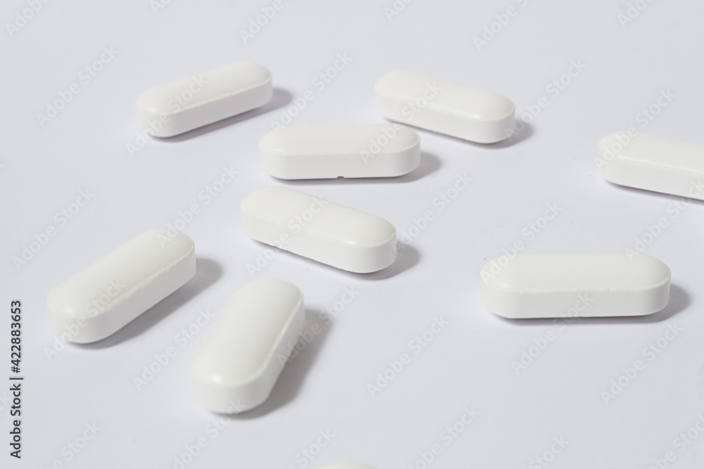 messy pills on white background messy pills on white background
