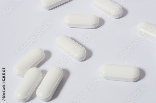 group of messy pills on white background