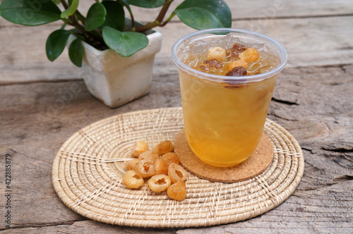 Cold dried longan water, golden color is a Thai herbal drink to quench your thirst, exhort heat add freshness, good for the body.