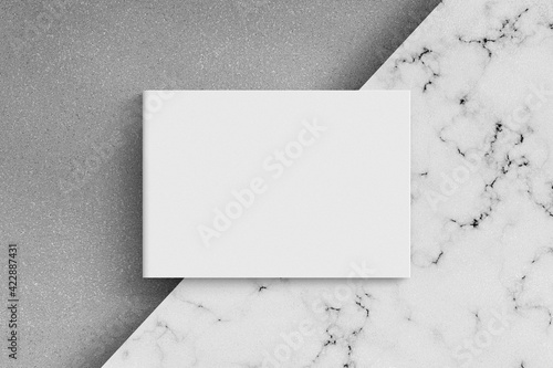 Magazine or catalog on white marble table.