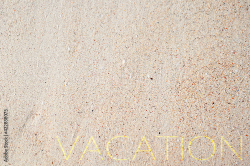 Summer Vacation and Travel Holiday or brandner Concept, Top view of Sand background on the beach with Yellow vacation wording
