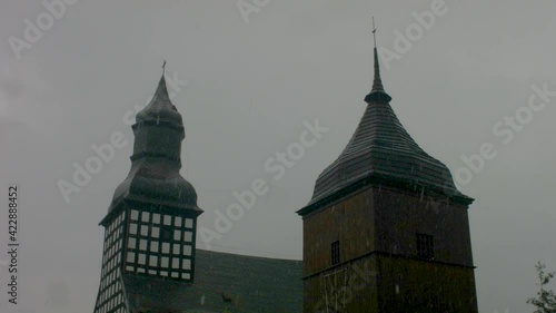 Two towers timelapse of weather changing over the church and belfry photo