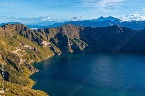 Panoramic aerial sunrise view of the volcanic Quilotoa crater lagoon with copy space, Quito region, Ecuador. © SL-Photography
