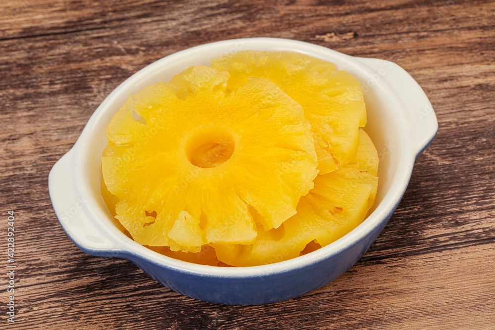 Marinated pineapple rings in the bowl Marinated pineapple rings in the bowl