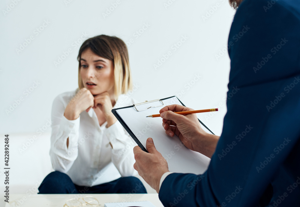 business man in blue jacket and women in the background at the table business man in blue jacket and women in the background at the table