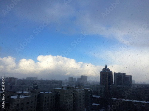 Architecture of modern city  skyline and blue sky with snowfall