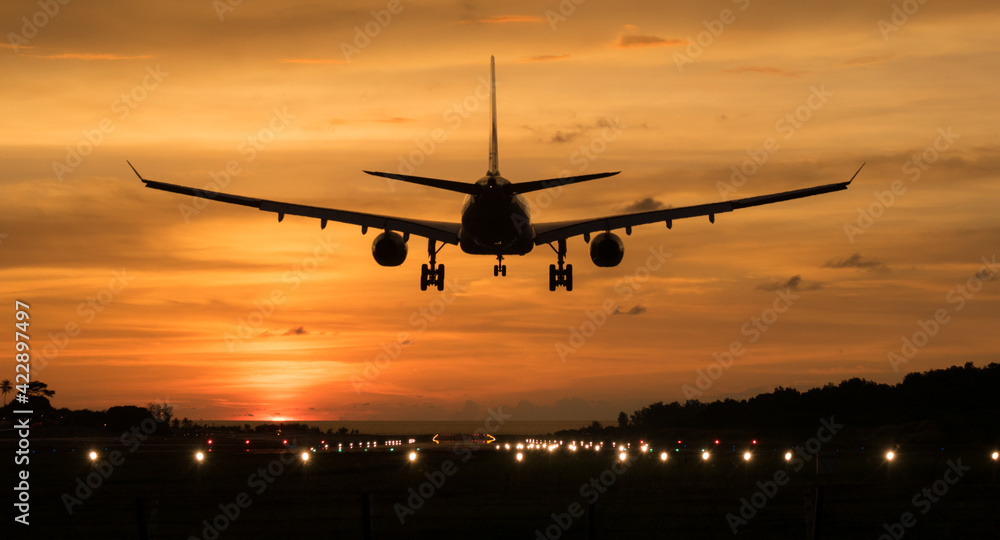 Silhouette Airplane will take-off at an airport during sunset sky
