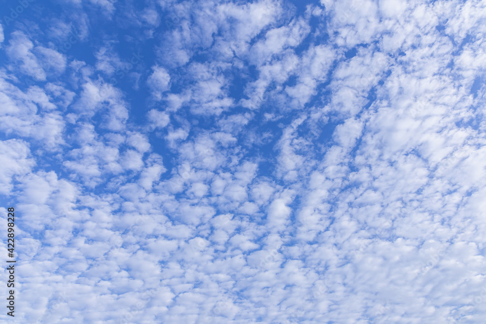 Blue sky background with tiny clouds for design