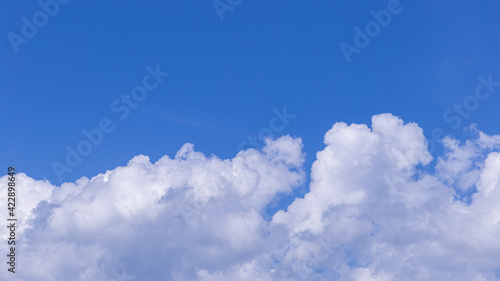 Blue sky background with tiny clouds for design
