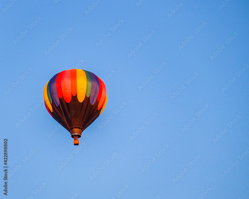 Hot air balloon in clear blue summer sky Hot air balloon in clear blue summer sky