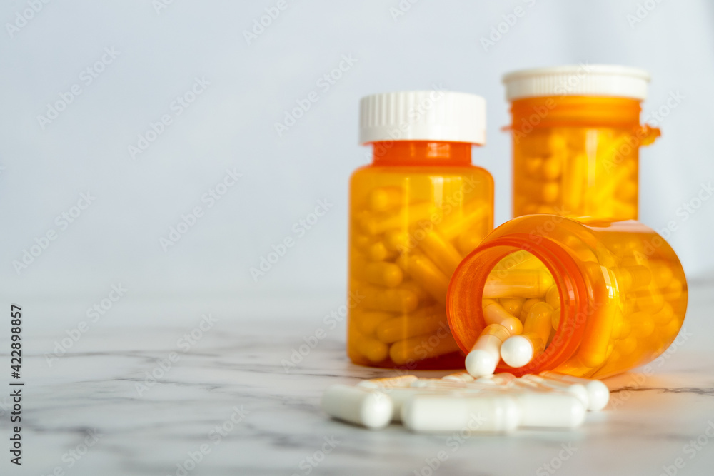 Pill bottles spilling out pills Pill bottles spilling out pills
