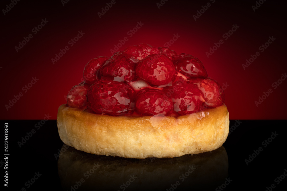 Fresh fruit pie tart with with raspberry on dark background Fresh fruit pie tart with with raspberry on dark background
