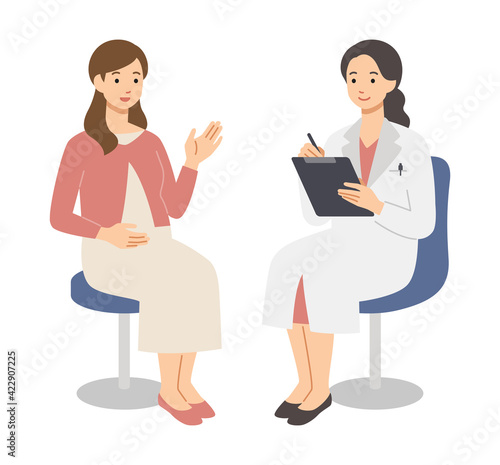若い妊婦を診察する女性医師