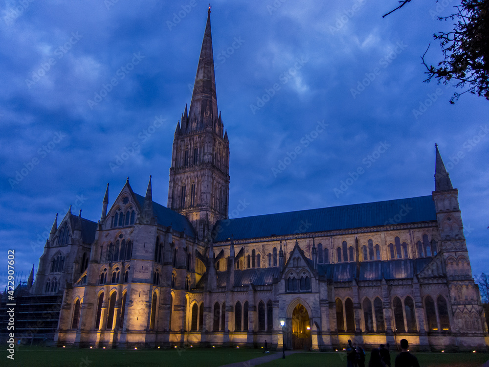 Salisbury Cathedral at night. Tallest spire in the UK on Anglican cathedral in early English architectural style in Wiltshire England