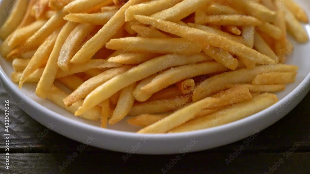French fries or potato chips with sour cream and ketchup French fries or potato chips with sour cream and ketchup