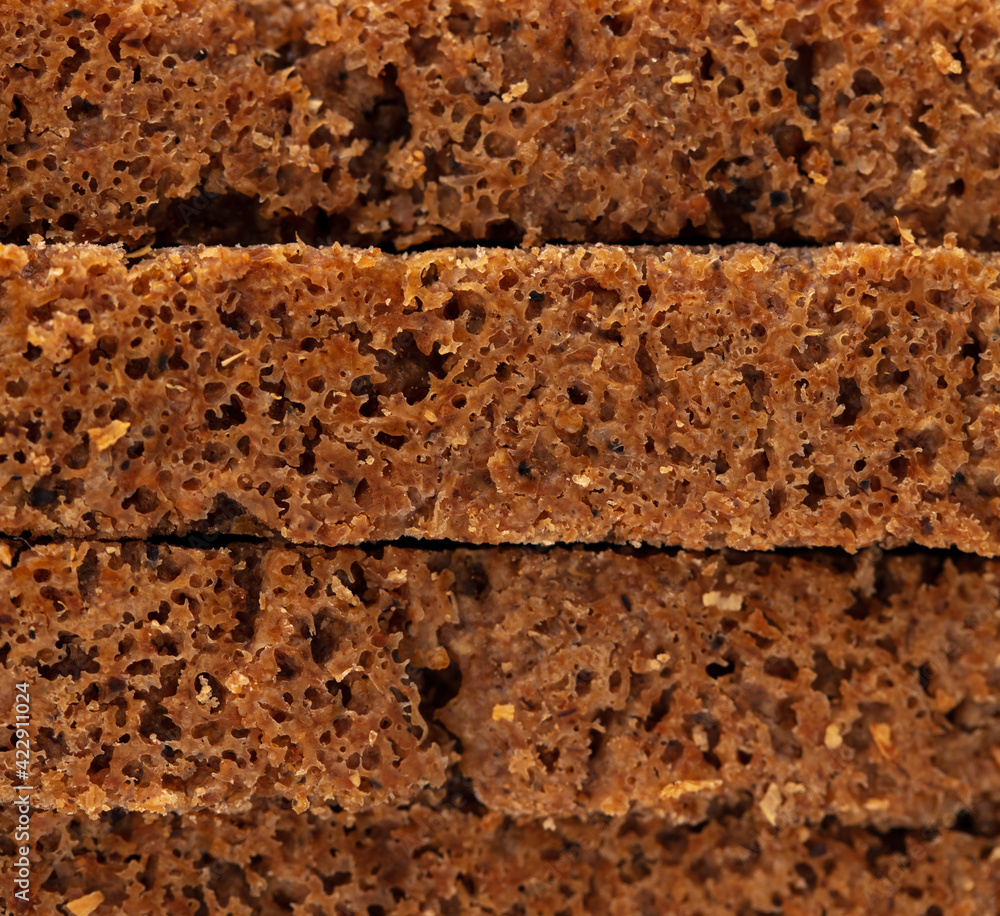 Black rye bread as background. Black rye bread as background.